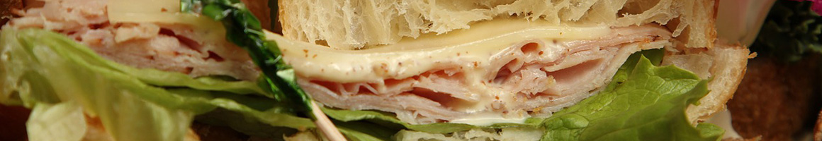 Eating Sandwich Cheesesteak at Taste of Philly restaurant in Denver, CO.